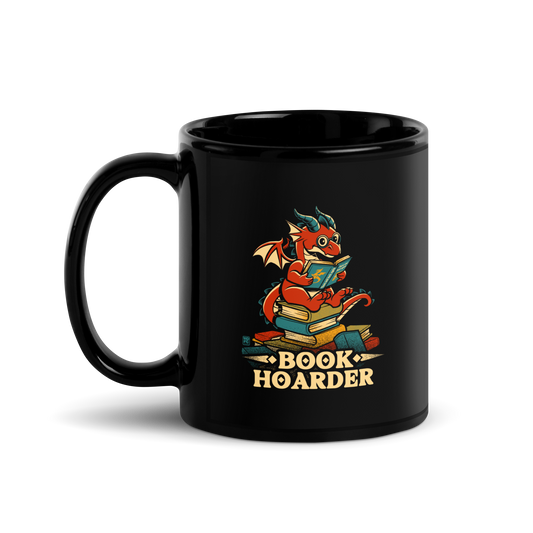 Perched atop his treasure trove of books, this red nerdy dragon is ready to devour epic adventures, magic tales, and fantasy worlds. The words 'BOOK HOARDER' are placed at the bottom of the design.