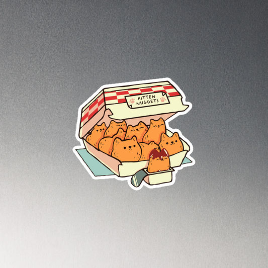 A box of cute nuggets that are shaped like cute kittens. An art that mixes humor, kittens and fast food.