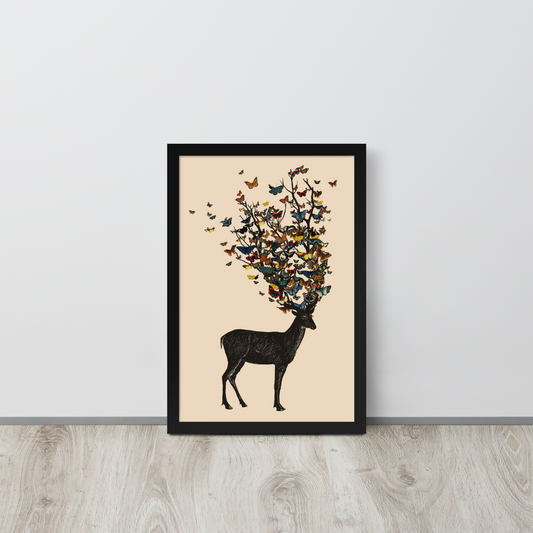 The image depicts a dark, silhouetted deer standing on a neutral background. Instead of branches, its antlers transform into a swirling cloud of vibrant, colorful butterflies that extend upwards and outward. The mix of organic and ethereal elements creates a captivating and whimsical visual contrast.