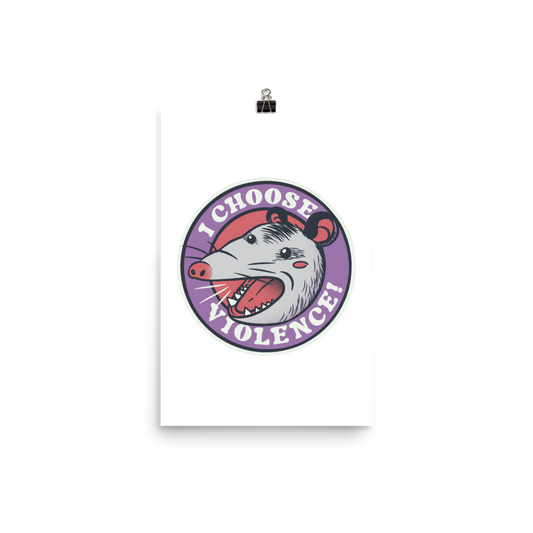 A circular design featuring an opossum with an open mouth showing sharp teeth, set against a red and purple background. Surrounding the animal, the text reads 'I Choose Violence!' in bold, white letters. The opossum has a somewhat comical yet aggressive expression. The design has an edgy, cartoon-like style, suitable for various products like t-shirts and stickers.