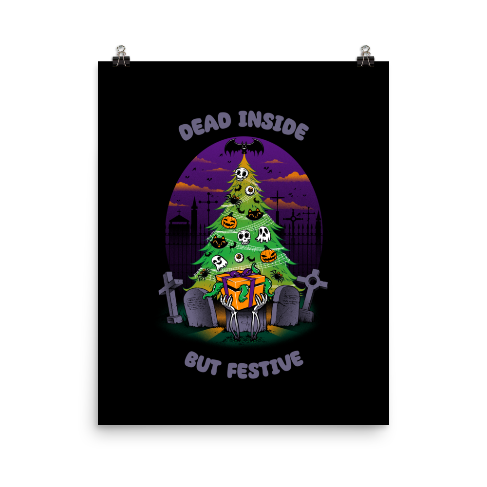 A quirky illustration features a Christmas tree decorated with skulls, pumpkins, and bats, set in a graveyard. The sky is purple and orange, with bats and tombstones surrounding the tree. A skeleton hand holds a festive gift box at the base. Above, text reads "Dead Inside" and below, "But Festive". The design combines Halloween and Christmas elements in a humorous style, highlighting a gothic and festive theme.