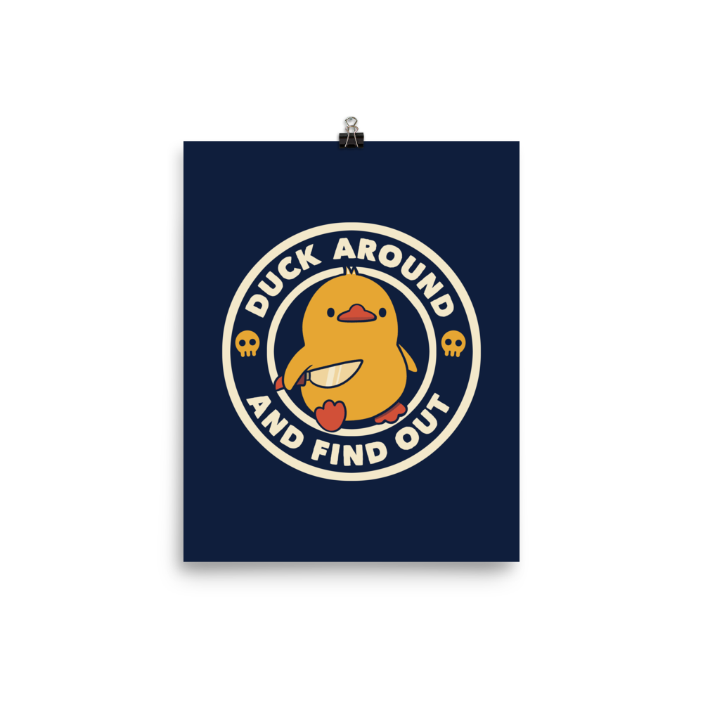 A cute yellow duck holding a small knife, around it the text "Duck Around And Find Out". An art that mixes humor with the temperament of ducks.