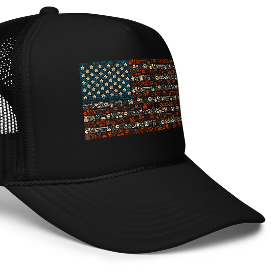 American flag illustration made entirely of retro video game icons, controllers, characters, and symbols in blue, red, and beige, arranged to form the stars and stripes.