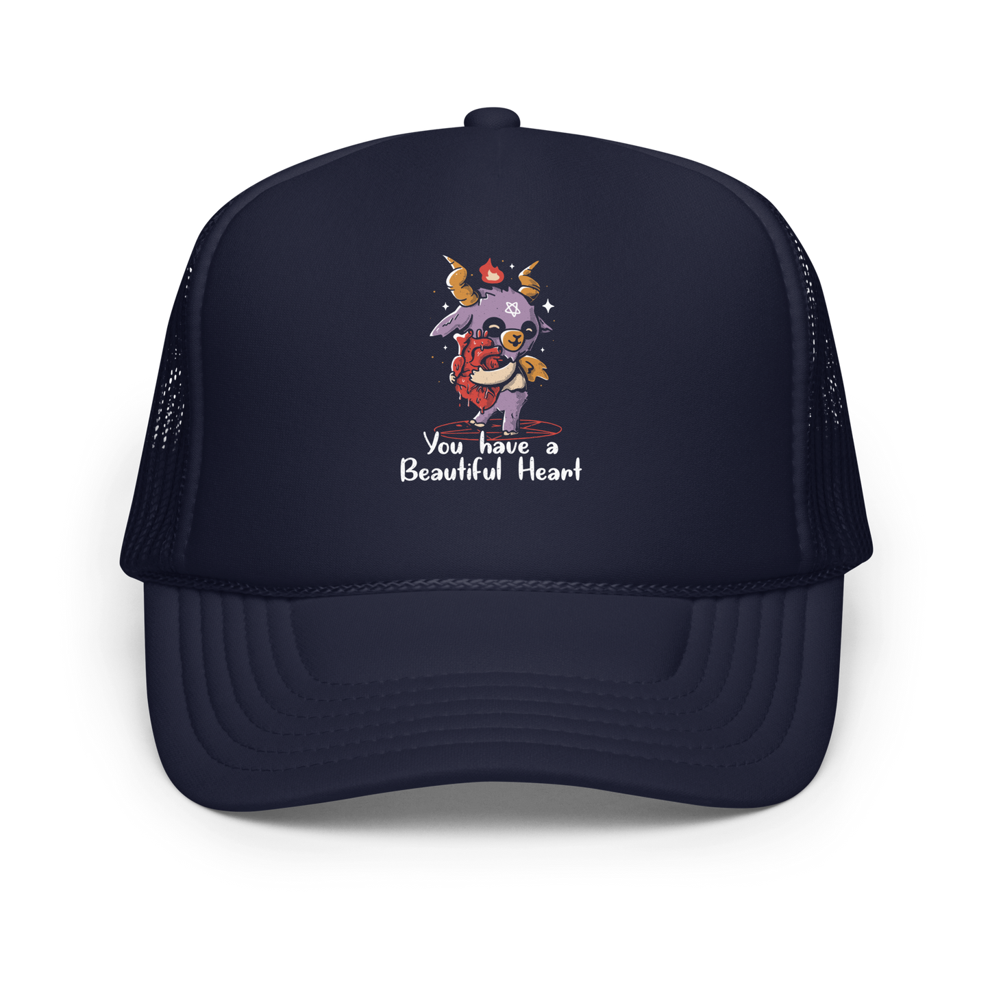 The design features a cute, cartoonish, anthropomorphic goat with big horns and a flame above its head, standing on a red pentagram. The goat has a star on its forehead and is hugging a large, anatomically correct human heart. The text below reads, 'You have a Beautiful Heart'. The image combines elements of occult symbolism with a playful, endearing aesthetic.