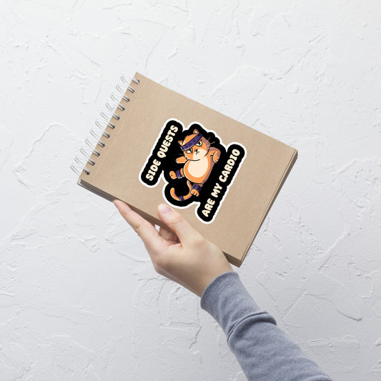 An orange kitten in gym clothes doing an aerobic workout, paired with the phrase ‘Side Quests Are My Cardio Gym Cat’. A humorous design that mixes cats, gaming vibes and fitness irony, perfect for those who prefer playful side quests over serious workouts.