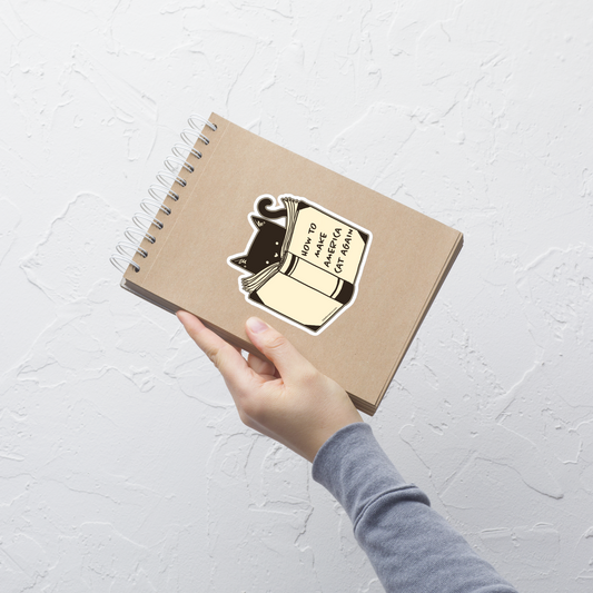 A minimalist illustration of a cat reading a book titled “How to Make America Cat Again”. A clean, witty design that blends feline charm with ironic humor, perfect for cat lovers and fans of clever, minimalist art.