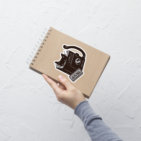 A minimalist illustration of a black kitten reading a book titled “World Domination for Cats,” featuring a humorous “Do Not Remove From Library” sticker. A playful artwork that captures the clever and ambitious nature of cats, perfect for cat lovers and fans of witty minimalist designs.
