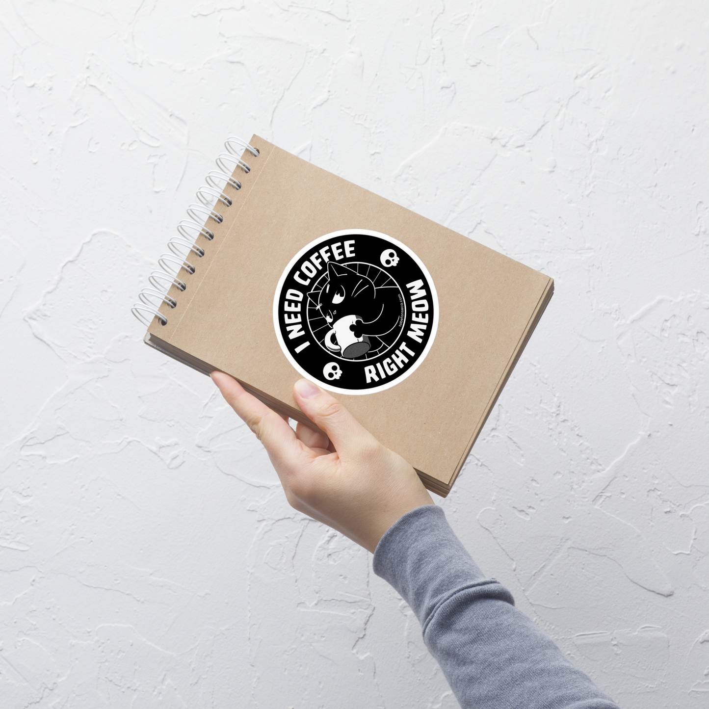 A black cat enjoying a hot cup of coffee, paired with the phrase ‘I Need Coffee Right Meow’. This playful design blends feline charm with caffeine-fuelled attitude, perfect for cat lovers who can’t function without their morning brew. Cute, relatable and full of purr-sonality.