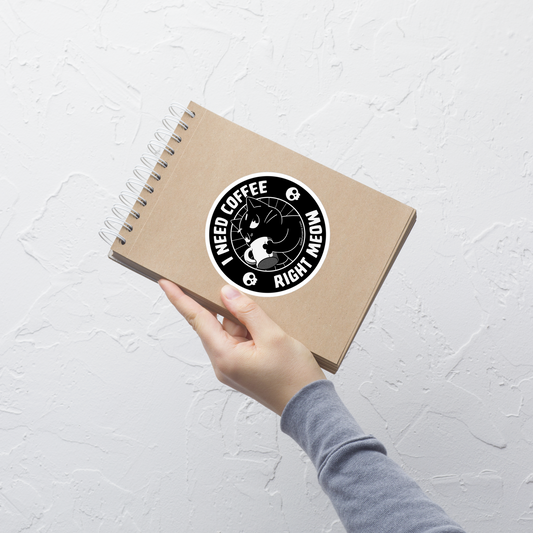 A black cat enjoying a hot cup of coffee, paired with the phrase ‘I Need Coffee Right Meow’. This playful design blends feline charm with caffeine-fuelled attitude, perfect for cat lovers who can’t function without their morning brew. Cute, relatable and full of purr-sonality.