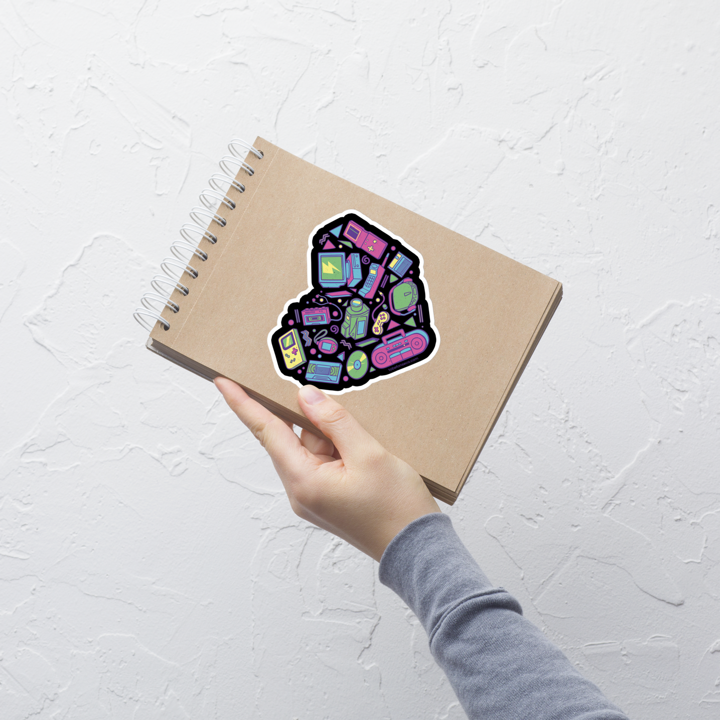 A heart made of iconic 90s electronics like computers, Walkmans, telephones, video game consoles, and Discmen, all in vibrant neon colours. A bold, nostalgic artwork perfect for anyone who loves retro tech and 90s vibes.