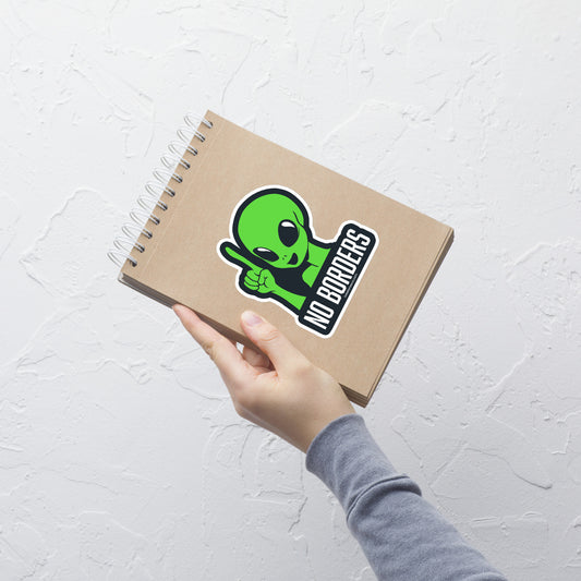 A green alien depicted with a raised finger, accompanied by the phrase "No Borders".