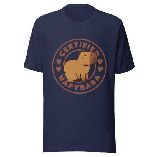 An art piece in warm beige and brown tones featuring a relaxed, sleepy capybara sitting peacefully beside the phrase “Certified Napybara”. A cozy, humorous design perfect for anyone who relates to slow days, loves capybaras, and fully embraces the art of taking naps.