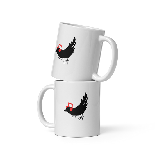 The drawing is a black silhouette of a bird in profile, standing on the ground, with bright red musical notes positioned like headphones over its ears, creating a whimsical and playful contrast. The drawing is simple, using solid colors and minimal details, giving it a modern and fun feel suitable for various merchandise like t-shirts, stickers, coffee cups, and skateboards.