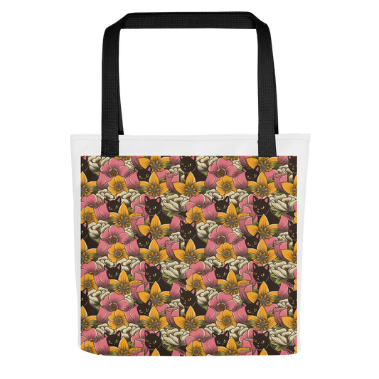 The image features a repeating pattern of colorful flowers in pink, yellow, and cream hues with lush green foliage. Interspersed among the flowers are playful black cats with bright eyes. The design has a whimsical and vibrant feel, ideal for various products like t-shirts, stickers, coffee cups, and skateboards. The style is reminiscent of traditional floral art blended with playful elements of animal decor.