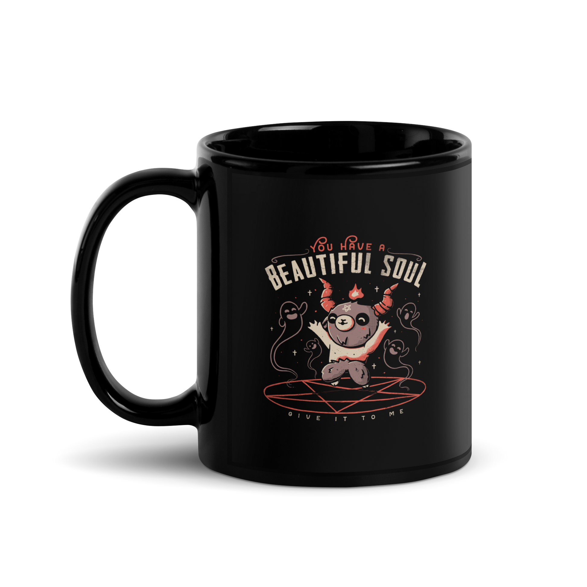 This design features a cute, cartoonish character with horns and a pentagram on its forehead, standing on a red circle with ghost-like figures surrounding it. Above the character, the text reads 'You have a beautiful soul,' and below, 'Give it to me.' The design contrasts dark and cute imagery with playful lettering.