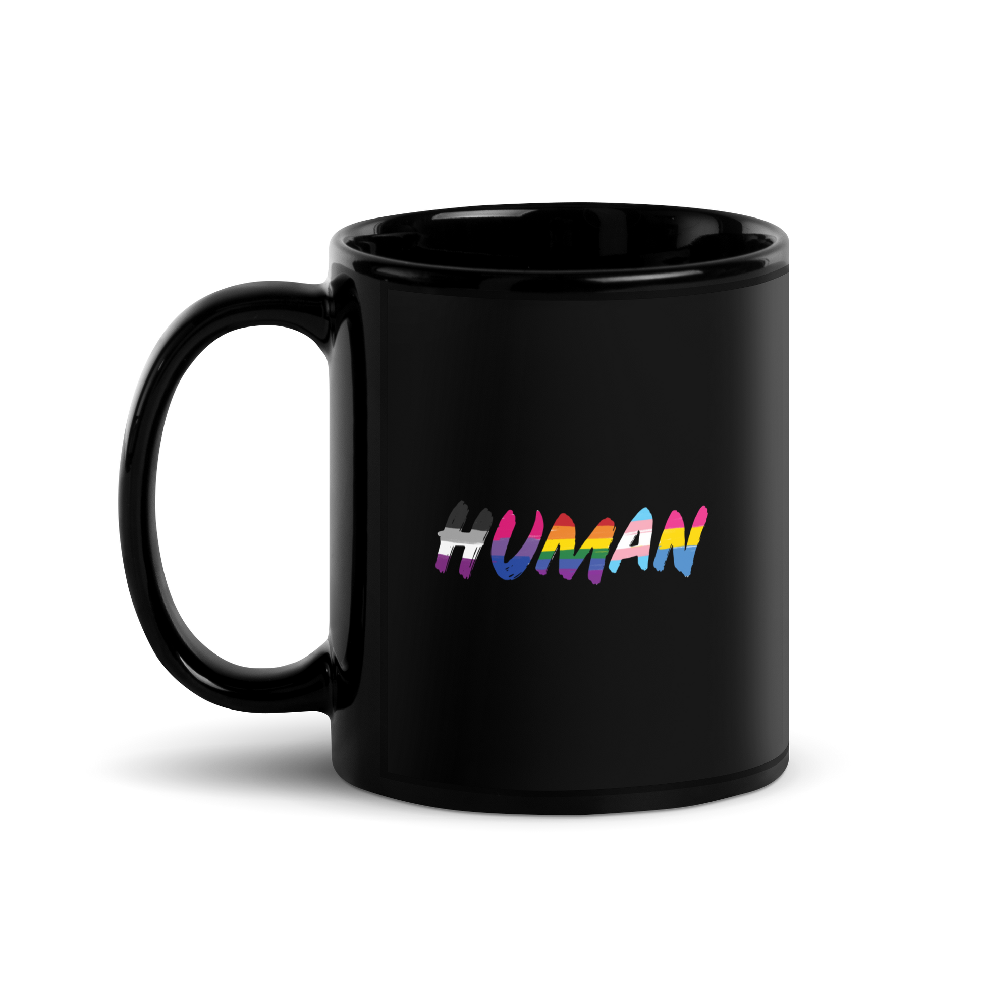 The image displays the word 'HUMAN' in bold, capitalized letters filled with colorful pride flag patterns. The colors within the letters represent different LGBTQ+ pride flags, symbolizing inclusivity and diversity. The background is solid black, which makes the colorful patterns stand out more vibrantly.