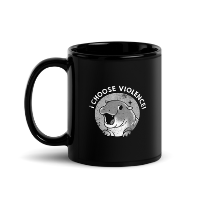 The image features a cartoonish illustration of a happy, open-mouthed hippo with paws raised, set within a circular design. Above it, bold text reads 'I CHOOSE VIOLENCE!' The design is monochrome with a textured, retro print style, suggesting a playful yet ironic tone.