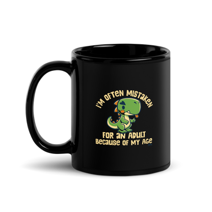 Cute cartoon dinosaur standing with a funny expression, accompanied by the humorous phrase “I’m Often Mistaken for an Adult Because of My Age” in bold distressed lettering.