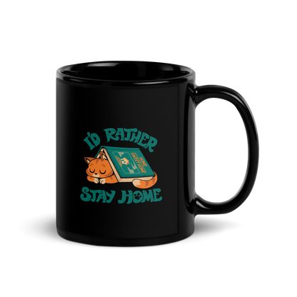 Sleeping orange cat under a book labeled 'Home Sweet Home' with the motto 'I'D RATHER STAY HOME'.