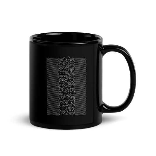 The drawing is a series of continuous wavy lines forming a pattern reminiscent of sound waves or topographic maps, but with an unexpected twist: the lines create the shapes of numerous cat faces stacked vertically. Each cat has simple, expressive features with pointed ears, adding a whimsical element to the otherwise structured pattern.