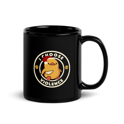 The image depicts a cute, cartoon-style yellow duckling wearing a Santa hat, holding a knife. It is encircled by the phrase 'I CHOOSE VIOLENCE' with small skull icons on either side of the ring. The overall tone is humorous and ironic, combining the traditionally non-violent image of a duckling with the aggressive message. The style is playful, with a mix of Christmas elements and dark humor.