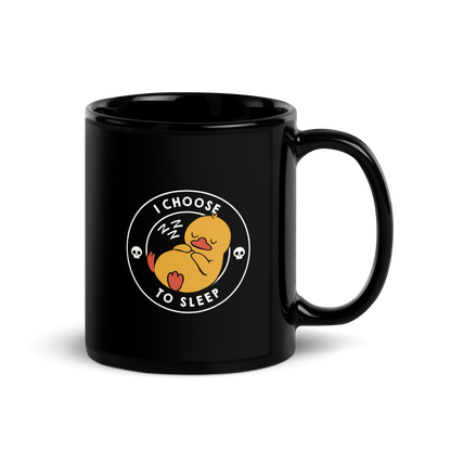 A cute, cartoonish yellow duck is peacefully sleeping with a contented expression. Its webbed feet and wings are tucked in. Around it, the words 'I Choose to Sleep' are inscribed in white letters. Two small skulls accompany this text, adding a humorous, edgy touch. The design is simple, charming, and playful, appealing to fans of ironic, whimsical art.