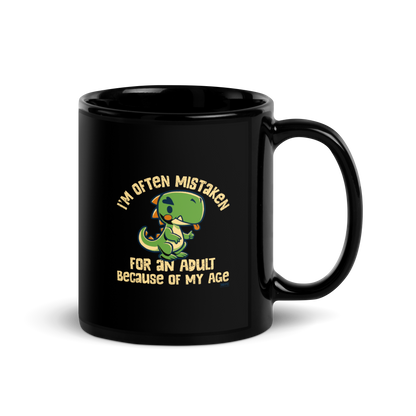 Cute cartoon dinosaur standing with a funny expression, accompanied by the humorous phrase “I’m Often Mistaken for an Adult Because of My Age” in bold distressed lettering.