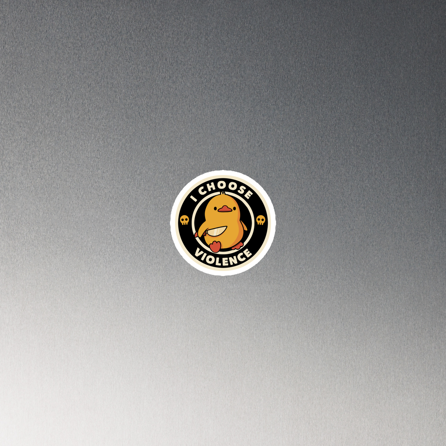 A cute, cartoon-style yellow duckling stands confidently holding a large knife in its wing. The duckling is encircled by text saying 'I CHOOSE VIOLENCE' in bold white letters. Small skull symbols flank the chick on either side, adding a touch of humor and irony to the otherwise adorable drawing.