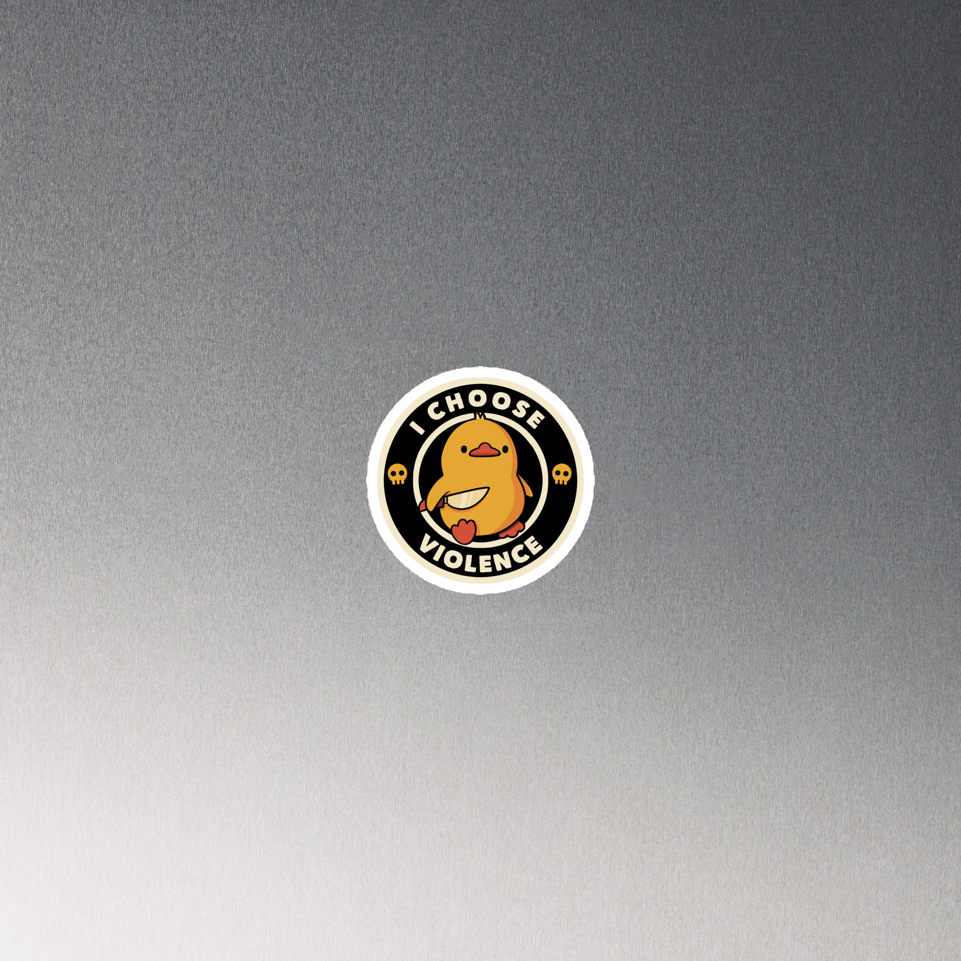 A cute, cartoon-style yellow duckling stands confidently holding a large knife in its wing. The duckling is encircled by text saying 'I CHOOSE VIOLENCE' in bold white letters. Small skull symbols flank the chick on either side, adding a touch of humor and irony to the otherwise adorable drawing.