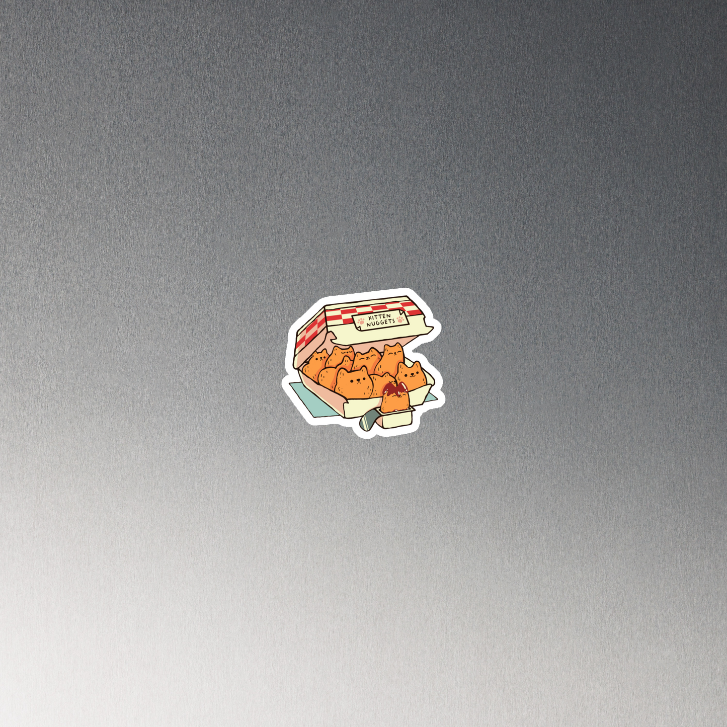 A box of cute nuggets that are shaped like cute kittens. An art that mixes humor, kittens and fast food.