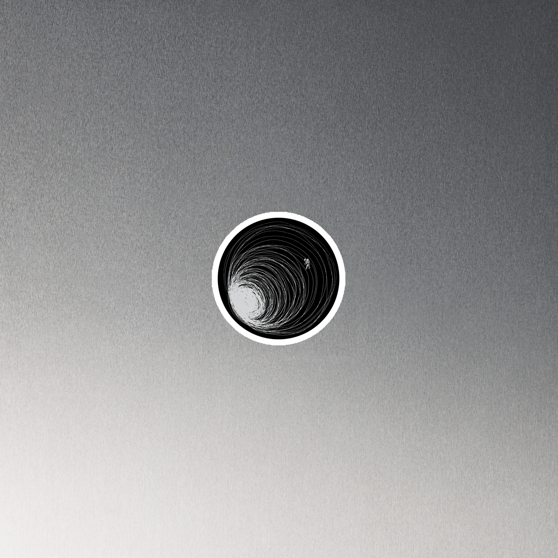 A big black hole with an astronaut floating around as if being sucked into it. A minimalist art perfect for those who love space.