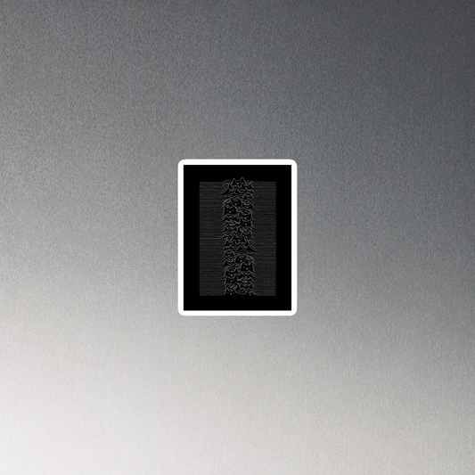 The drawing is a series of continuous wavy lines forming a pattern reminiscent of sound waves or topographic maps, but with an unexpected twist: the lines create the shapes of numerous cat faces stacked vertically. Each cat has simple, expressive features with pointed ears, adding a whimsical element to the otherwise structured pattern.