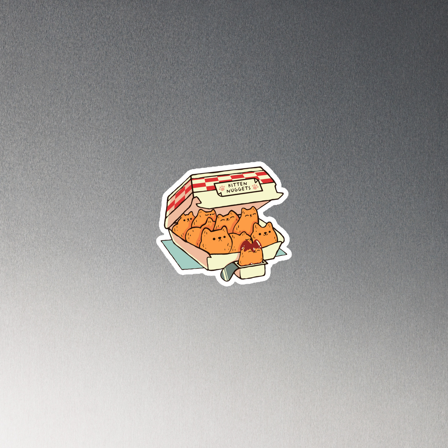 A box of cute nuggets that are shaped like cute kittens. An art that mixes humor, kittens and fast food.
