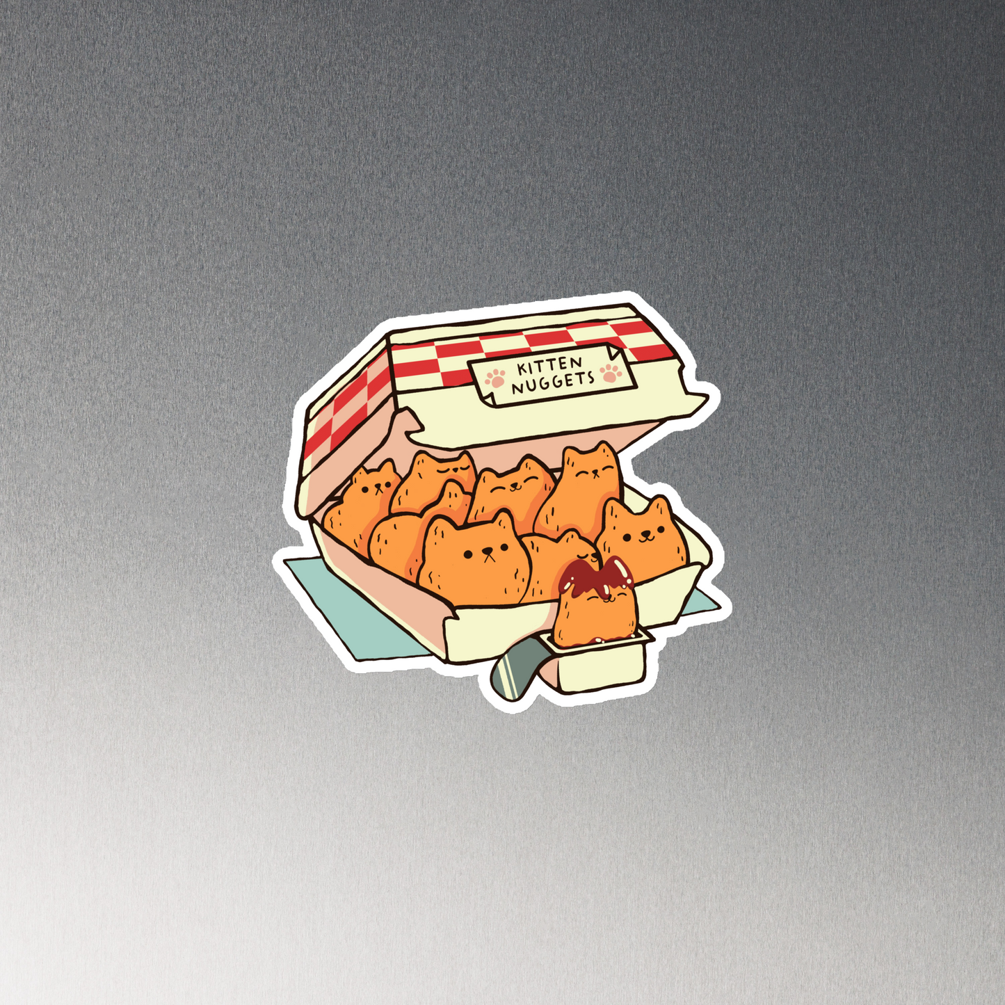 A box of cute nuggets that are shaped like cute kittens. An art that mixes humor, kittens and fast food.