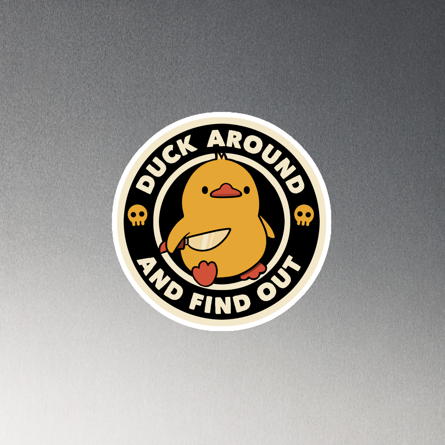A cute yellow duck holding a small knife, around it the text "Duck Around And Find Out". An art that mixes humor with the temperament of ducks.