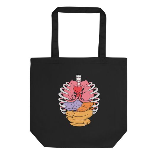 The image features a unique and colorful illustration of six whimsical cats nestled within and around a human ribcage. Each cat is a different bright color, ranging from pink and purple to orange and yellow, creating a visually appealing and vibrant composition. The use of contrasting colors and playful subject matter gives it a charming and eye-catching style.