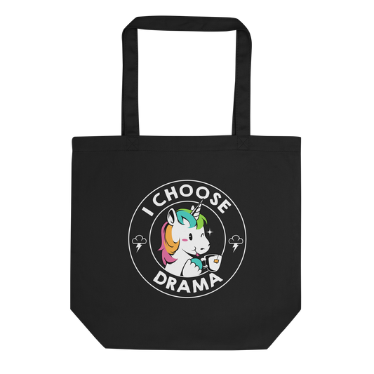 A cartoon unicorn with rainbow-colored mane holds a cup of tea and a heart, encircled by the words 'I Choose Drama'. Two small clouds with lightning bolts flank the unicorn, adding a playful yet slightly edgy vibe. The design is bold and whimsical with a pop-art influence.