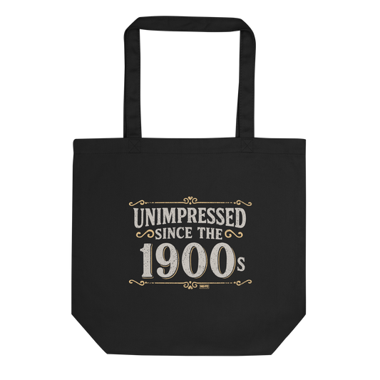Vintage-style graphic with the phrase “Unimpressed Since the 1900s” in bold distressed lettering, decorated with ornate flourishes and a retro color palette.