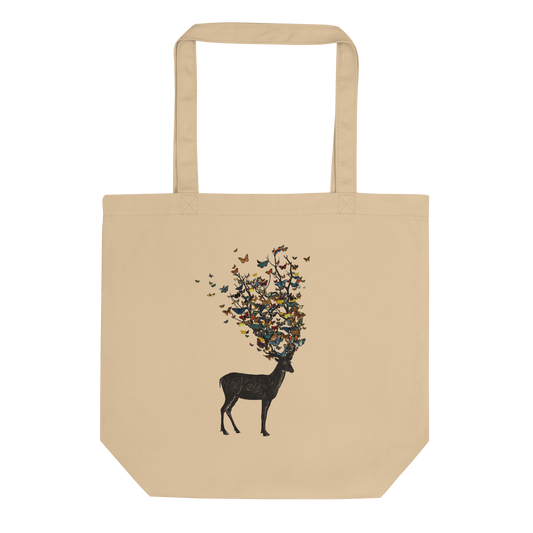 The image depicts a dark, silhouetted deer standing on a neutral background. Instead of branches, its antlers transform into a swirling cloud of vibrant, colorful butterflies that extend upwards and outward. The mix of organic and ethereal elements creates a captivating and whimsical visual contrast.