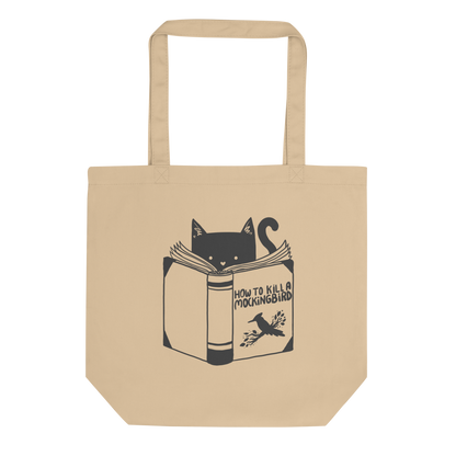 A black and white illustration features a cat peeking over an open book titled 'How to Kill a Mockingbird,' playfully altering the classic novel's title. The cat has a heart-shaped nose and simple, cute facial features. The design is whimsical and ironic, combining classic literature with a humorous twist.