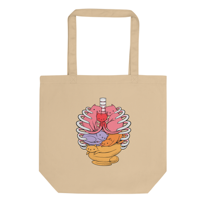 The image features a unique and colorful illustration of six whimsical cats nestled within and around a human ribcage. Each cat is a different bright color, ranging from pink and purple to orange and yellow, creating a visually appealing and vibrant composition. The use of contrasting colors and playful subject matter gives it a charming and eye-catching style.