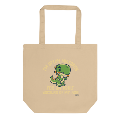 Cute cartoon dinosaur standing with a funny expression, accompanied by the humorous phrase “I’m Often Mistaken for an Adult Because of My Age” in bold distressed lettering.
