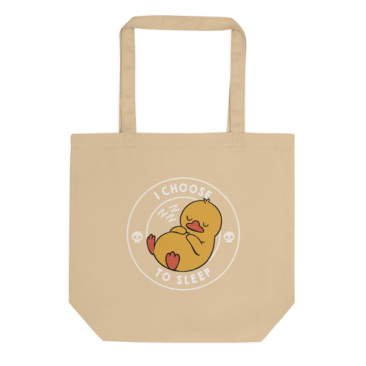A cute, cartoonish yellow duck is peacefully sleeping with a contented expression. Its webbed feet and wings are tucked in. Around it, the words 'I Choose to Sleep' are inscribed in white letters. Two small skulls accompany this text, adding a humorous, edgy touch. The design is simple, charming, and playful, appealing to fans of ironic, whimsical art.