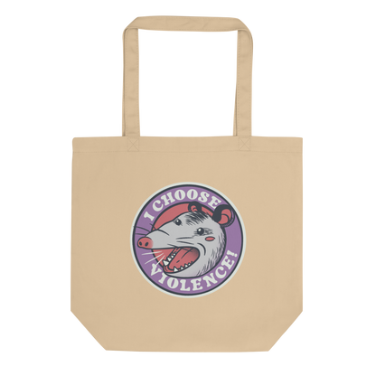 A circular design featuring an opossum with an open mouth showing sharp teeth, set against a red and purple background. Surrounding the animal, the text reads 'I Choose Violence!' in bold, white letters. The opossum has a somewhat comical yet aggressive expression. The design has an edgy, cartoon-like style, suitable for various products like t-shirts and stickers.
