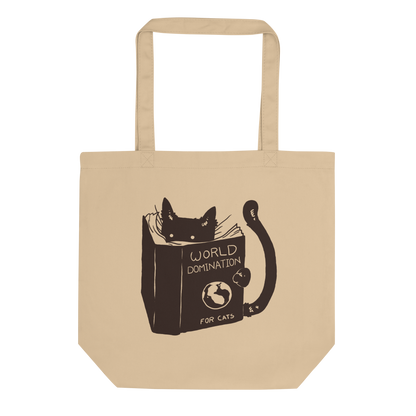 The design features a black silhouette of a cat peeking from behind an oversized book. The book's cover reads 'World Domination for Cats,' and includes a simple drawing of a globe. The cat's eyes are wide open, suggesting either surprise or intense focus on its 'world domination' plans.