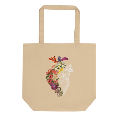 The design is an intricate and anatomical drawing of a human heart on a black background. The left side of the heart morphs into a vibrant assortment of colorful flowers, including roses, daisies, and other blooming blossoms, creating a striking contrast between the realistic and the surreal, symbolizing the harmony between nature and humanity.