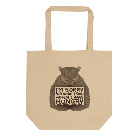 The image shows a humorous, detailed illustration of a bear, drawn in a hand-drawn style, holding a sign that reads 'I'm sorry for what I said when I was hungry.' The bear appears to be apologizing in a comical, endearing manner, making it a relatable and light-hearted design.