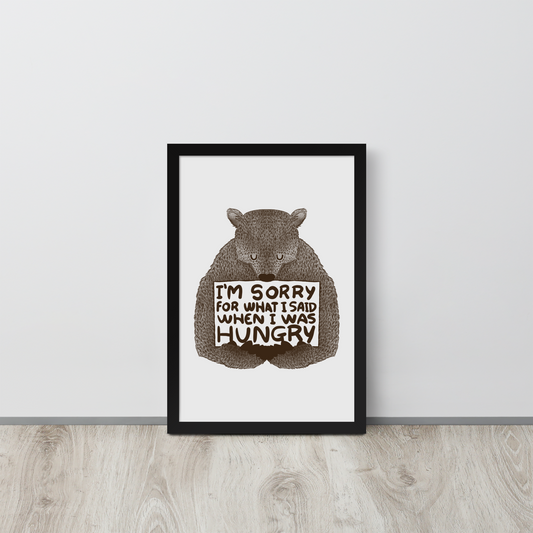 The image shows a humorous, detailed illustration of a bear, drawn in a hand-drawn style, holding a sign that reads 'I'm sorry for what I said when I was hungry.' The bear appears to be apologizing in a comical, endearing manner, making it a relatable and light-hearted design.