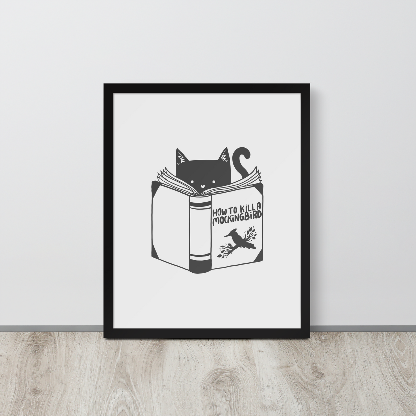 A black and white illustration features a cat peeking over an open book titled 'How to Kill a Mockingbird,' playfully altering the classic novel's title. The cat has a heart-shaped nose and simple, cute facial features. The design is whimsical and ironic, combining classic literature with a humorous twist.