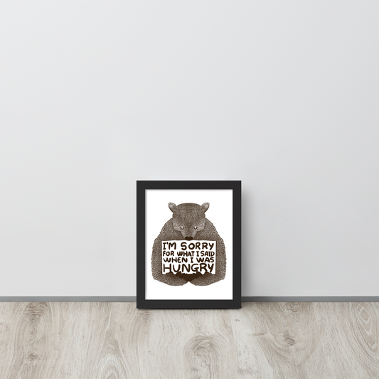 The image shows a humorous, detailed illustration of a bear, drawn in a hand-drawn style, holding a sign that reads 'I'm sorry for what I said when I was hungry.' The bear appears to be apologizing in a comical, endearing manner, making it a relatable and light-hearted design.